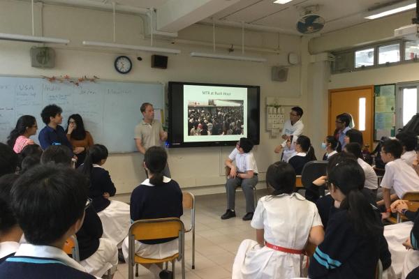 Students listen to speakers share their experiences during Global Awareness Week.